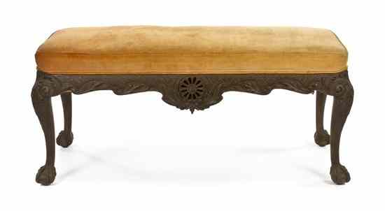 Appraisal: A Chippendale Style Carved Bench with upholstered rectangular seat over