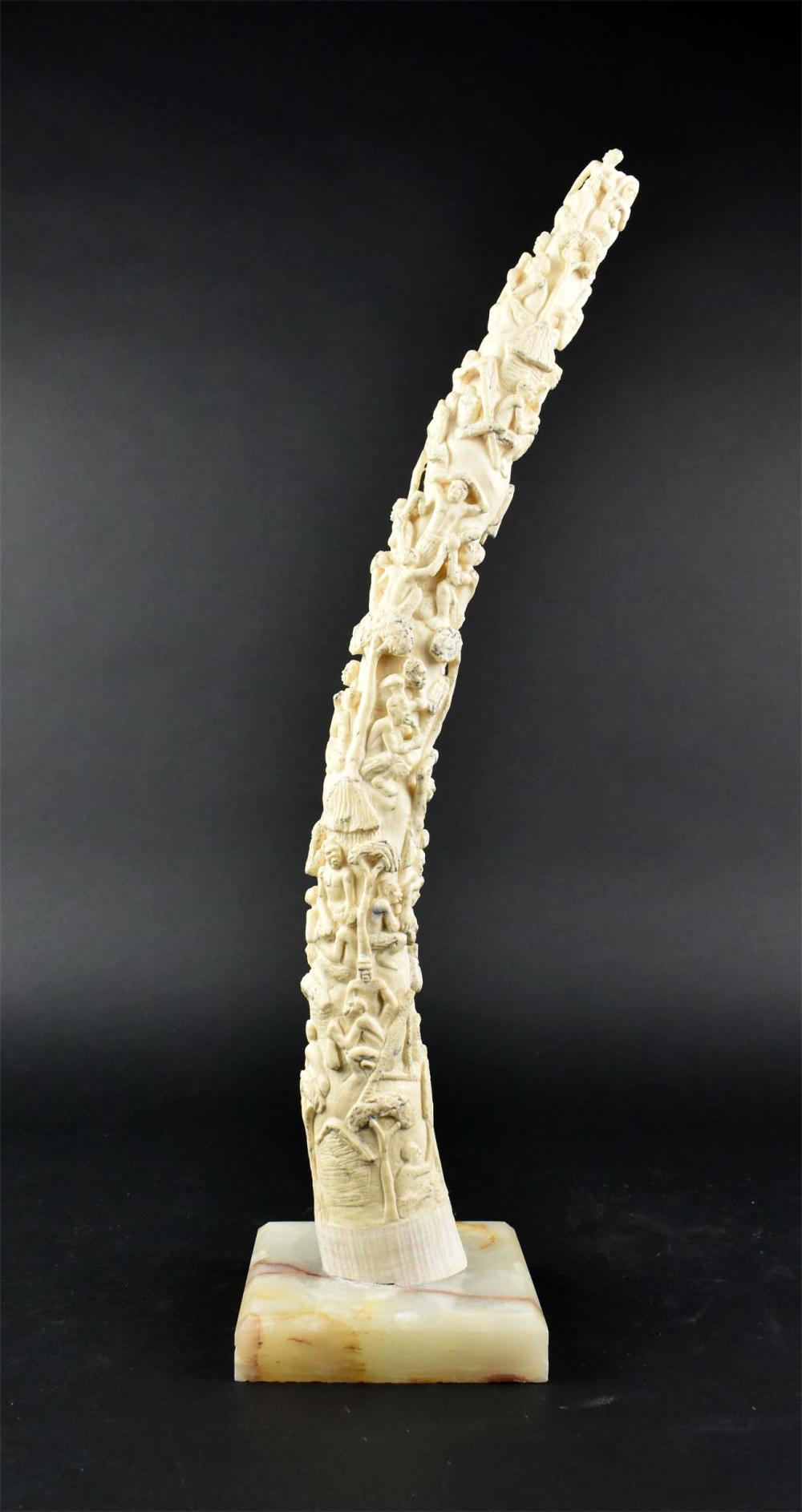 Appraisal: AFRICAN CARVED RESIN TUSK-FORM TOTEM th Century Depicting multiple indigenous