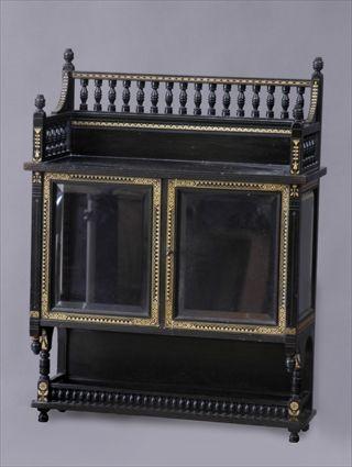 Appraisal: AESTHETIC MOVEMENT EBONIZED TWO-DOOR HANGING CABINET With spindled gallery above