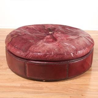 Appraisal: Giant distressed oxblood leather ottoman Giant distressed oxblood leather ottoman