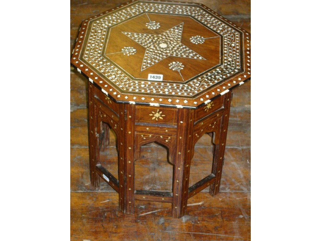 Appraisal: An eastern hardwood occasional table of octagonal form with profusely