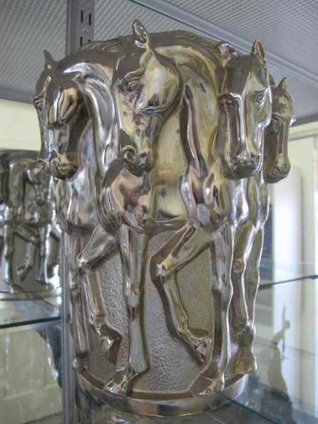 Appraisal: CAST METAL SILVERED VASE WITH REPEATING HORSE DECORATION