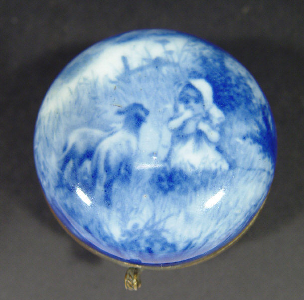 Appraisal: Bun shaped porcelain pill box and cover decorated in blue