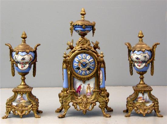 Appraisal: th century French gilt metal and porcelain clock garniture the