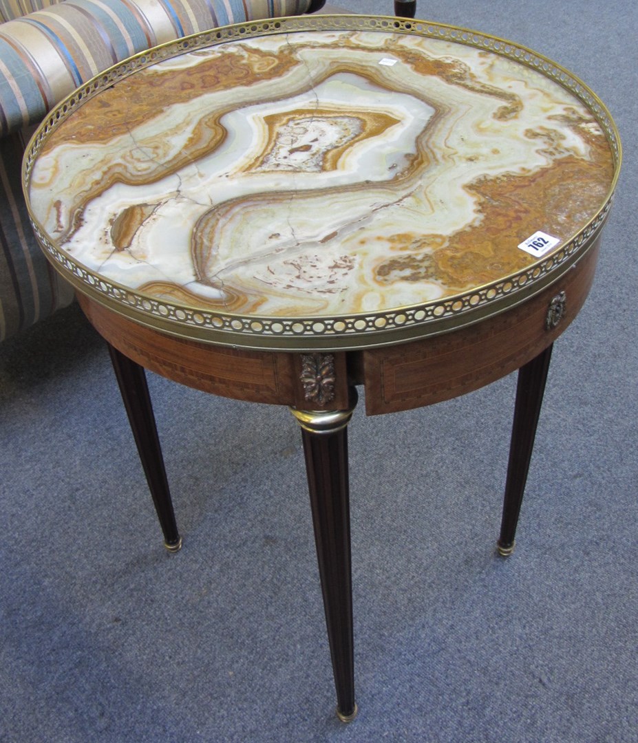 Appraisal: A th century French occasional table the brass bound circular