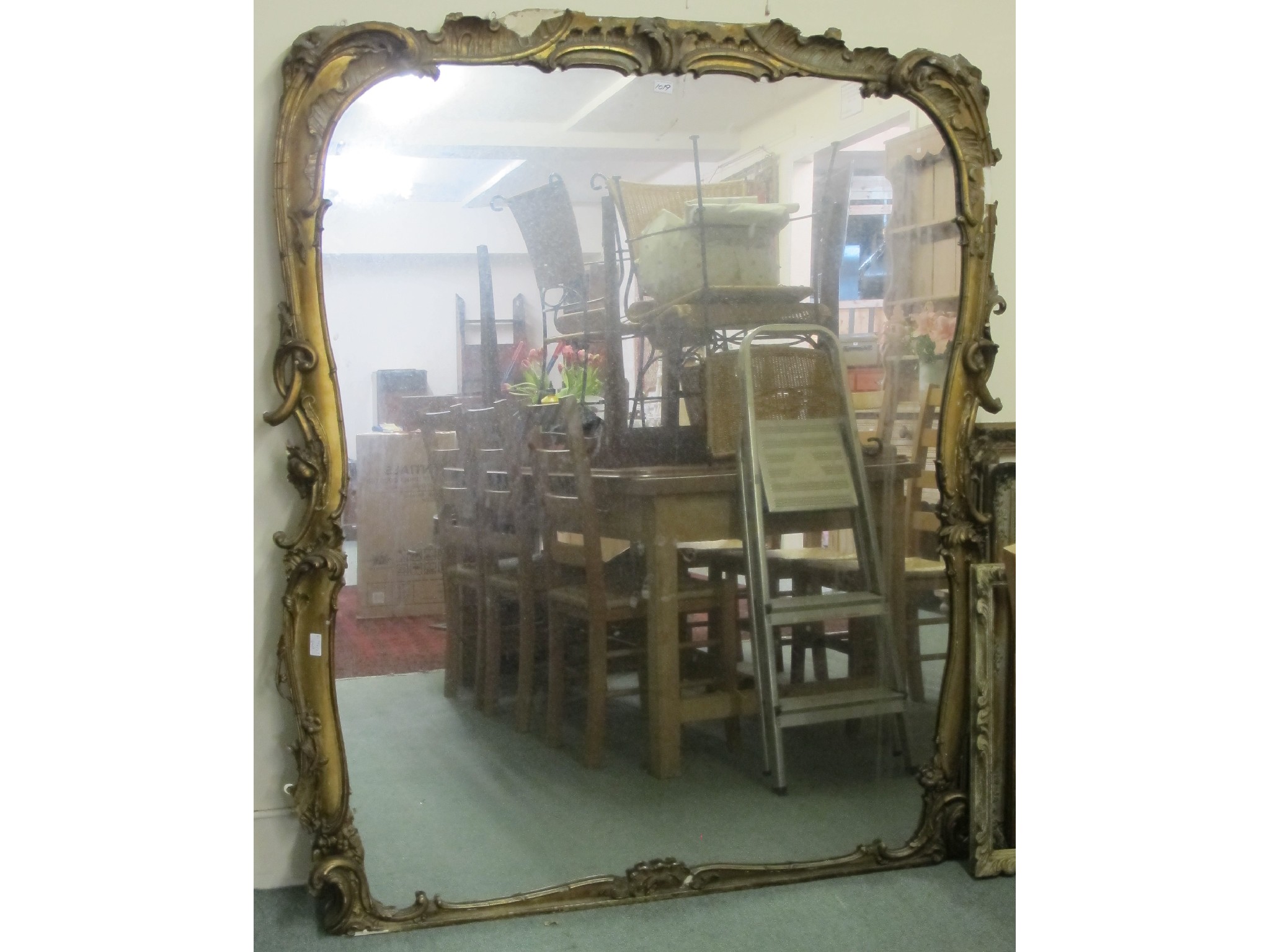 Appraisal: A large decorative gilt mirror def