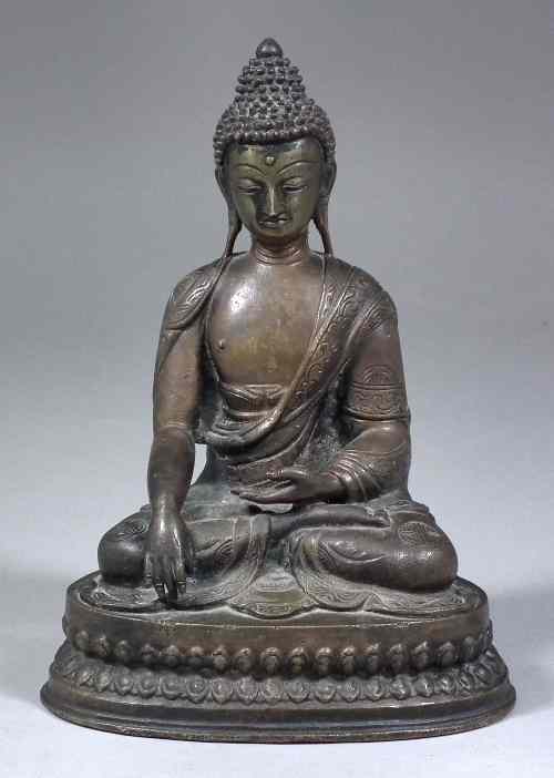 Appraisal: A Siamese patinated bronze figure of a seated Buddha on