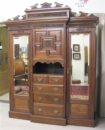 Appraisal: VICTORIAN CARVED MAHOGANY AND WALNUT WARDROBE DRESSER English c a