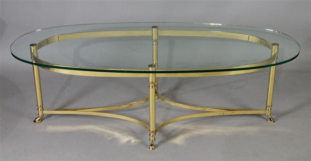 Appraisal: MODERN OVAL BRASS COFFEE TABLE WITH GLASS TOP the oval