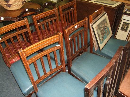 Appraisal: A set of six oak dining chairs of blue leatherette