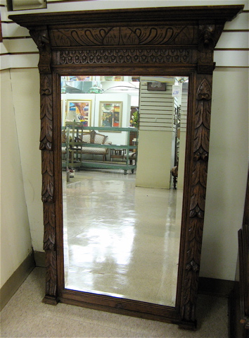 Appraisal: CARVED OAK PIER MIRROR Continental c the rectangular beveled mirror