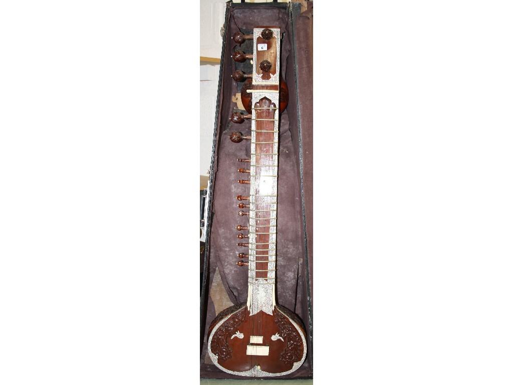 Appraisal: th century Indian sitar with typical carved hardwood and bone