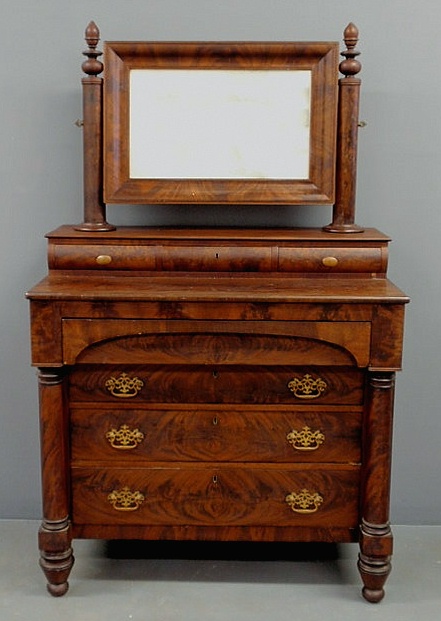 Appraisal: Empire mahogany chest of drawers with a mirrored back h