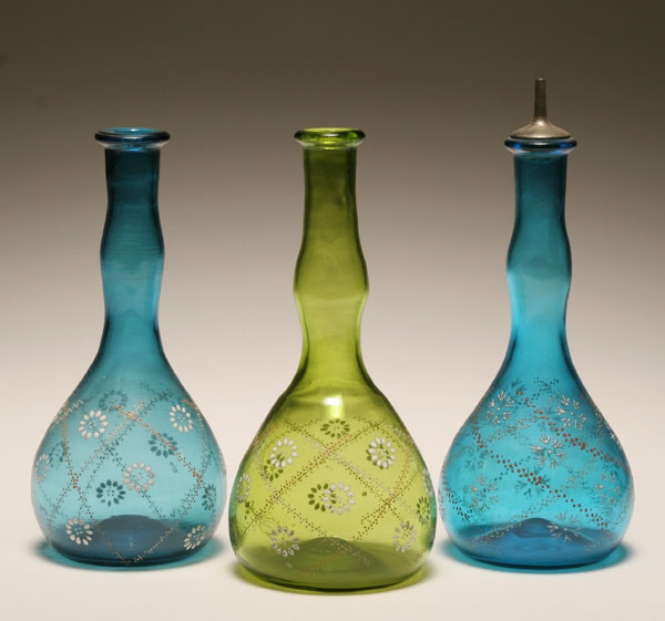 Appraisal: Three Victorian barber tonic bottles matching form and enameled daisy