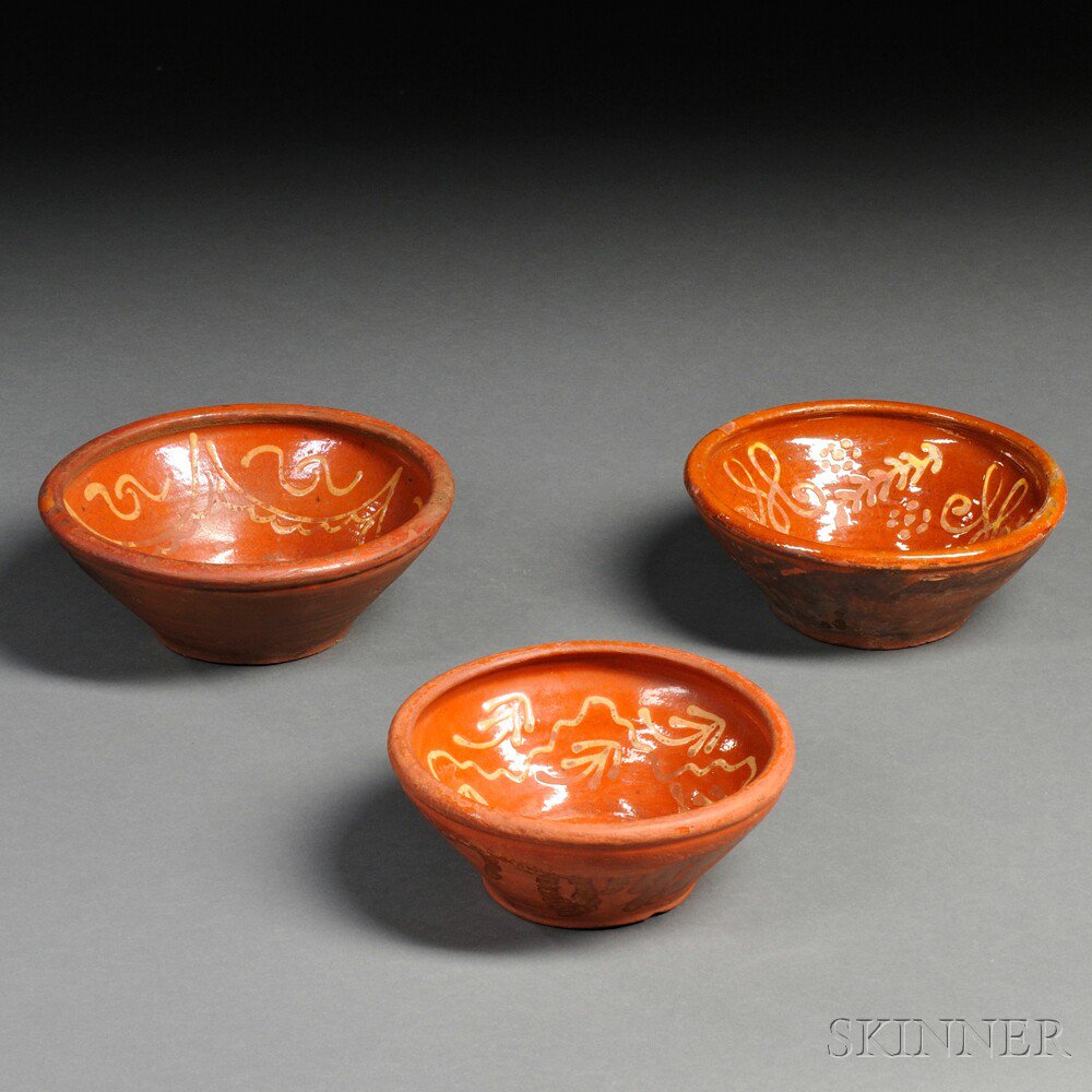 Appraisal: Three Slip-decorated Redware Bowls reportedly Pennsylvania th century each with