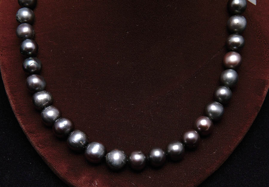 Appraisal: BLACK PEARL NECKLACE This wonderful l necklace is made up