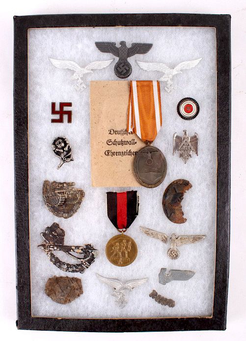 Appraisal: Nazi Medals Pins Tinnies and Battlefield Scraps Offered for sale