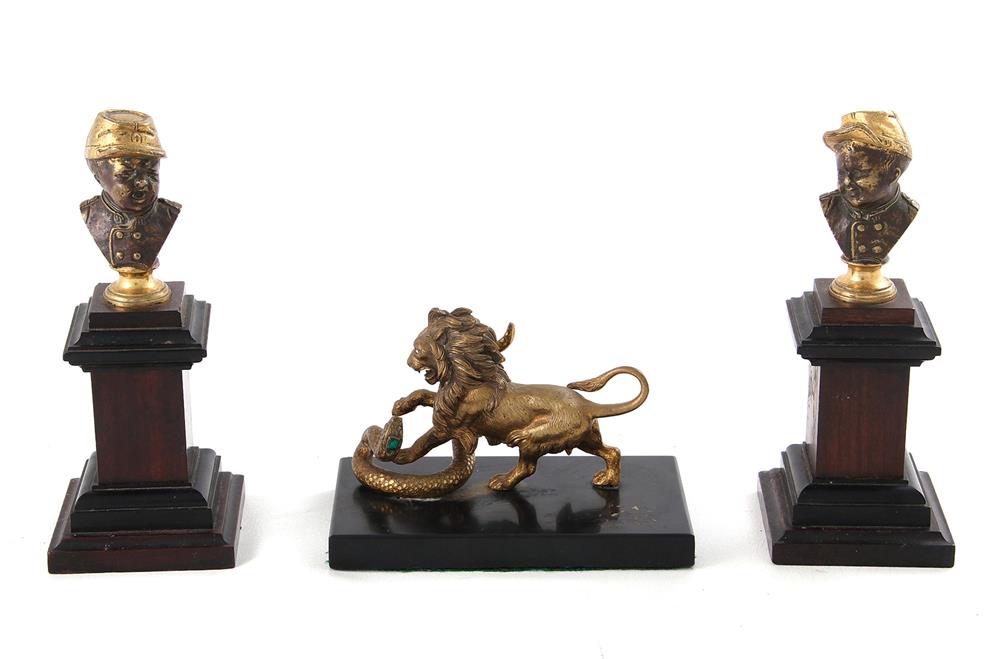 Appraisal: Pair bronze busts and lion sculpture pair parcel-gilt bronze infant