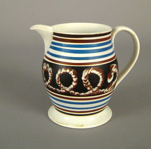 Appraisal: Mocha pitcher th c with earthworm decoration on a black