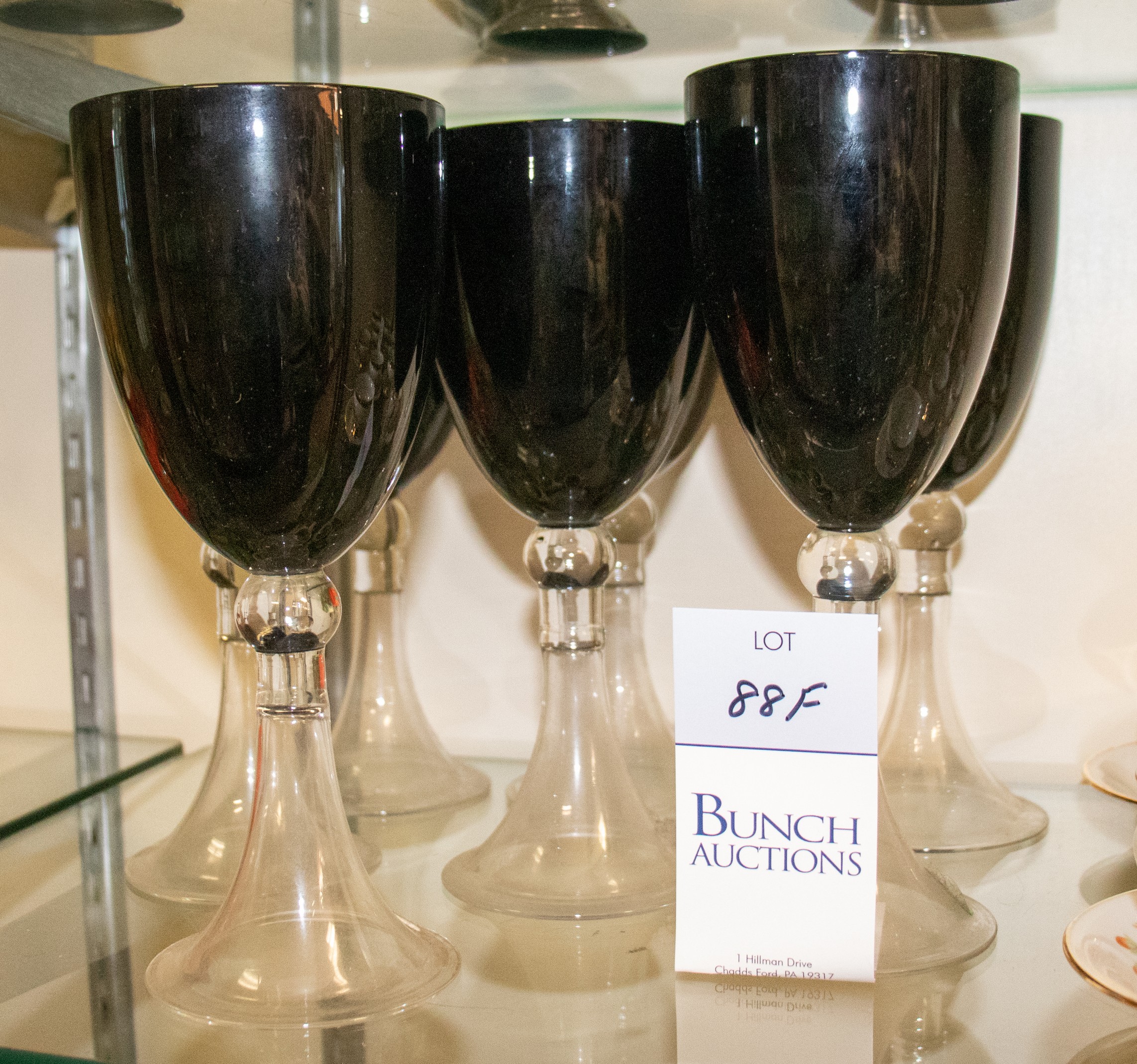 Appraisal: Black amethyst clear glass goblets colored bowls with clear hollow