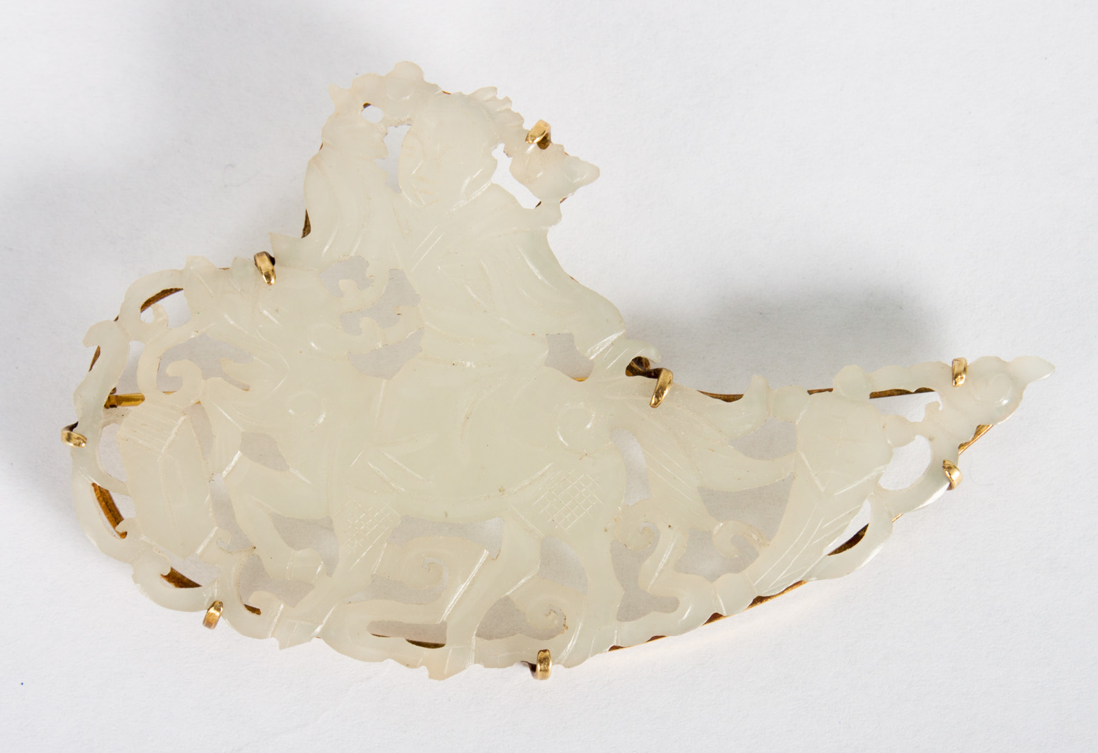 Appraisal: Chinese gold-mounted jade pin presenting a Ching reticulated gray-green jade