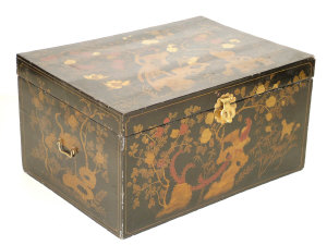 Appraisal: A black lacquered rectangular trunk the gilt painted peacock foliate