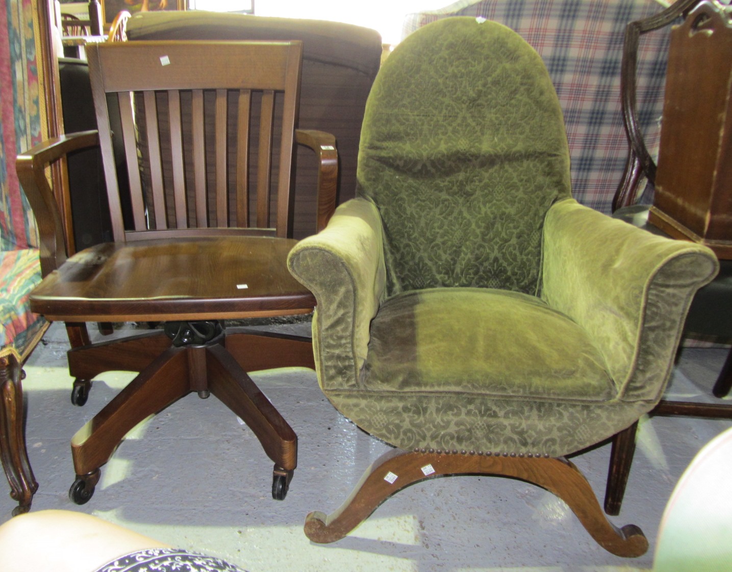 Appraisal: A th century mahogany swivel chair and a green upholstered