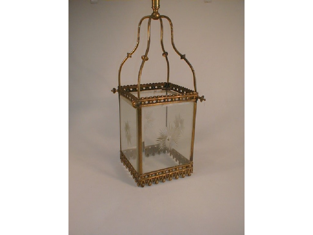 Appraisal: A hall lantern the punched brass frame enclosing four bevelled