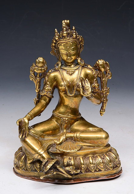 Appraisal: AN OLD NEPALESE BRASS SEATED BHUDDA on a shaped base