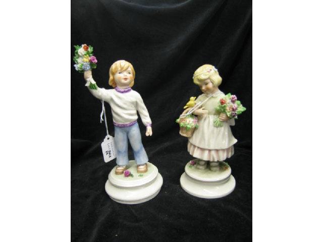 Appraisal: Pair of Goebel Porcelain Figurines flower seller boy girl signed