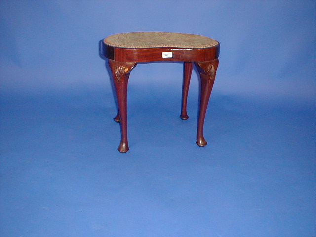 Appraisal: A mahogany kidney shape stool