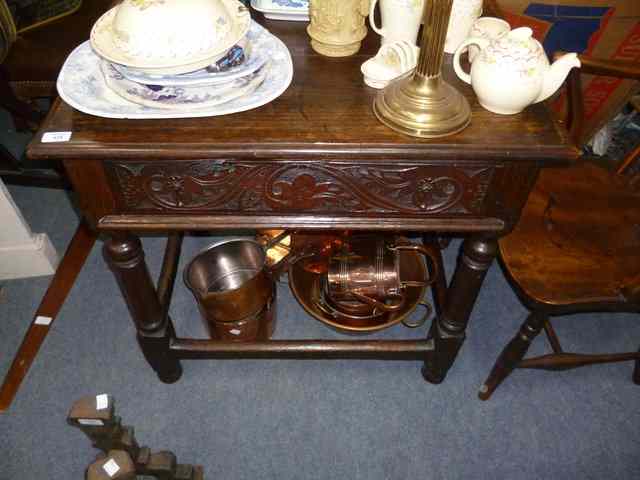 Appraisal: AN ANTIQUE OAK TABLE the rectangular top and single drawer