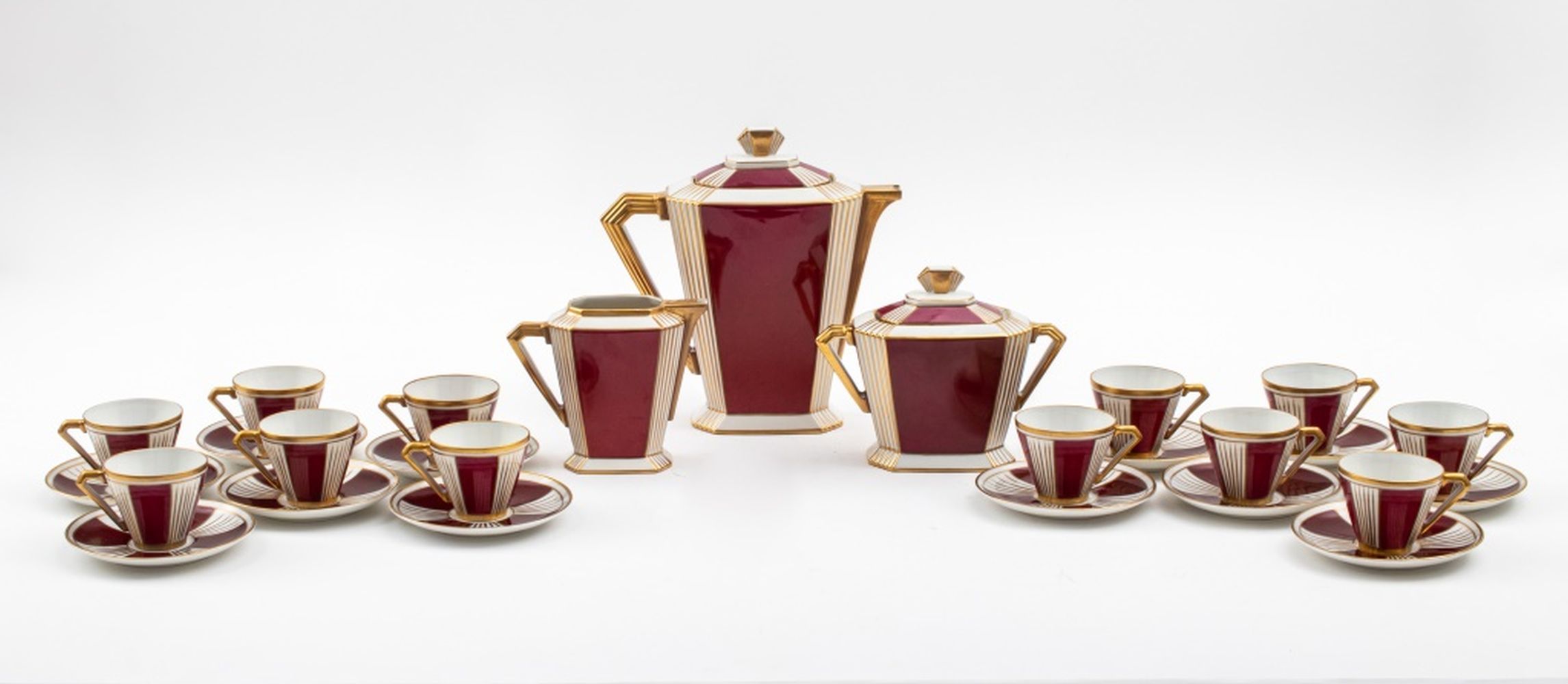 Appraisal: ART DECO GILDED SANG DE BOEUF COFFEE SET FOR Art