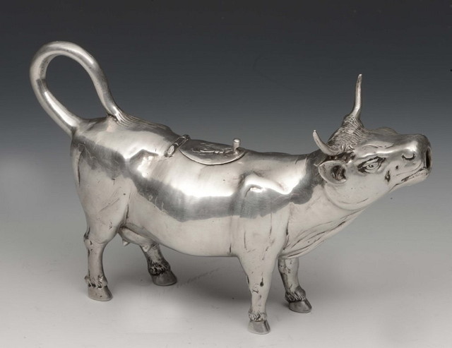 Appraisal: A DUTCH SILVER COW CREAMER with extravagant horns and tail