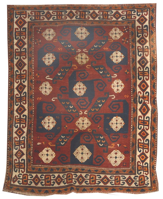 Appraisal: A CAUCASIAN KAZAK RUST GROUND RUG with stylised 'Pin Wheel'