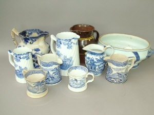 Appraisal: Two blue and white pearlware mugs printed with hunting scenes