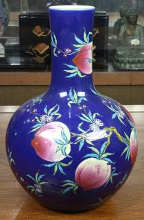 Appraisal: Chinese Stickneck Vase Peach Chinese enameled porcelain vase with a