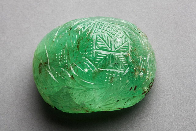 Appraisal: AN EMERALD STONE carved with leaves cm long grams in