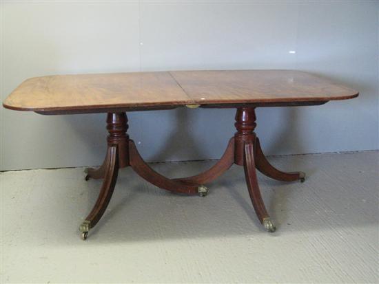 Appraisal: George III mahogany two pedestal dining table with rounded ends