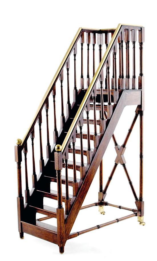 Appraisal: Mahogany whatnot staircase form with brass-covered baluster-supported rail joined with