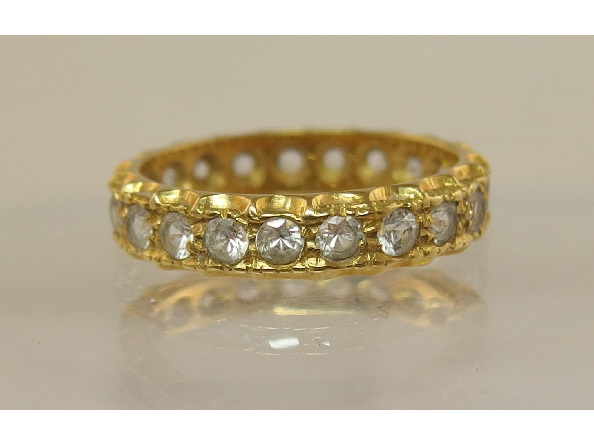 Appraisal: An ct gold full eternity ring set with clear gems