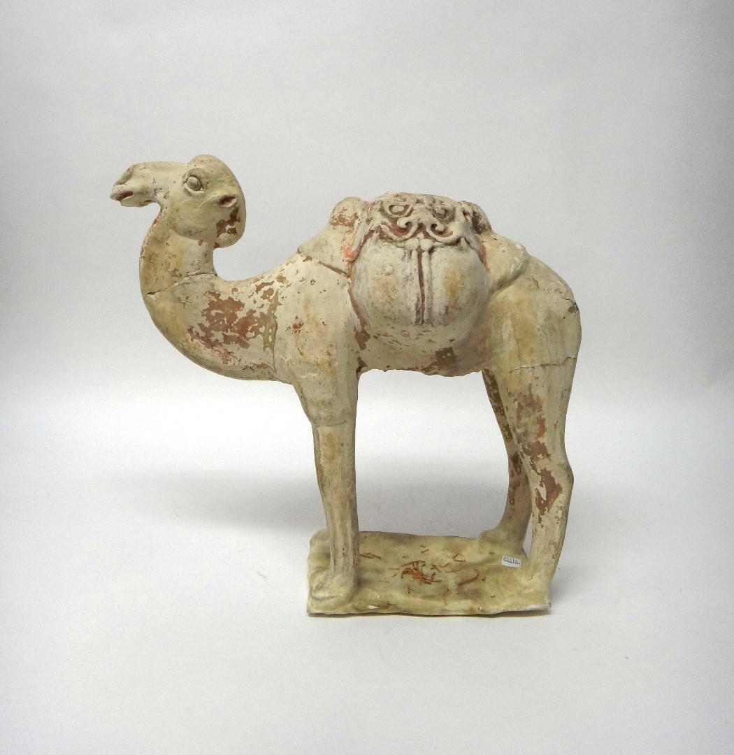 Appraisal: A Tang style pottery bactrian camel standing foursquare with saddle