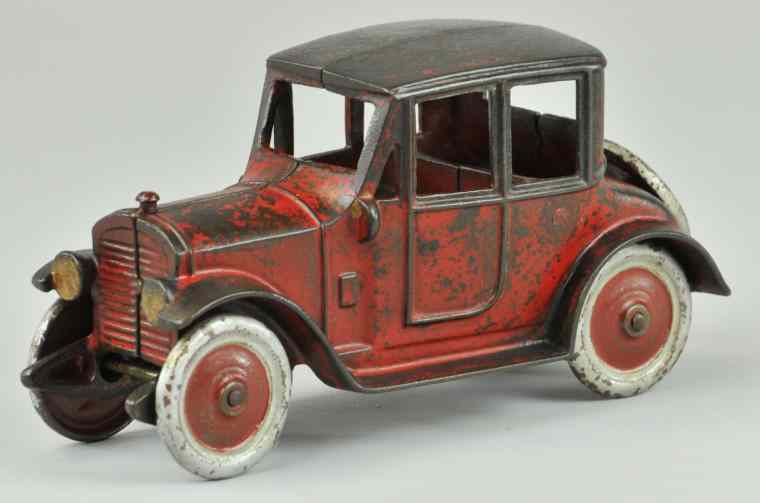 Appraisal: KENTON SEDAN c late 's cast iron painted in red