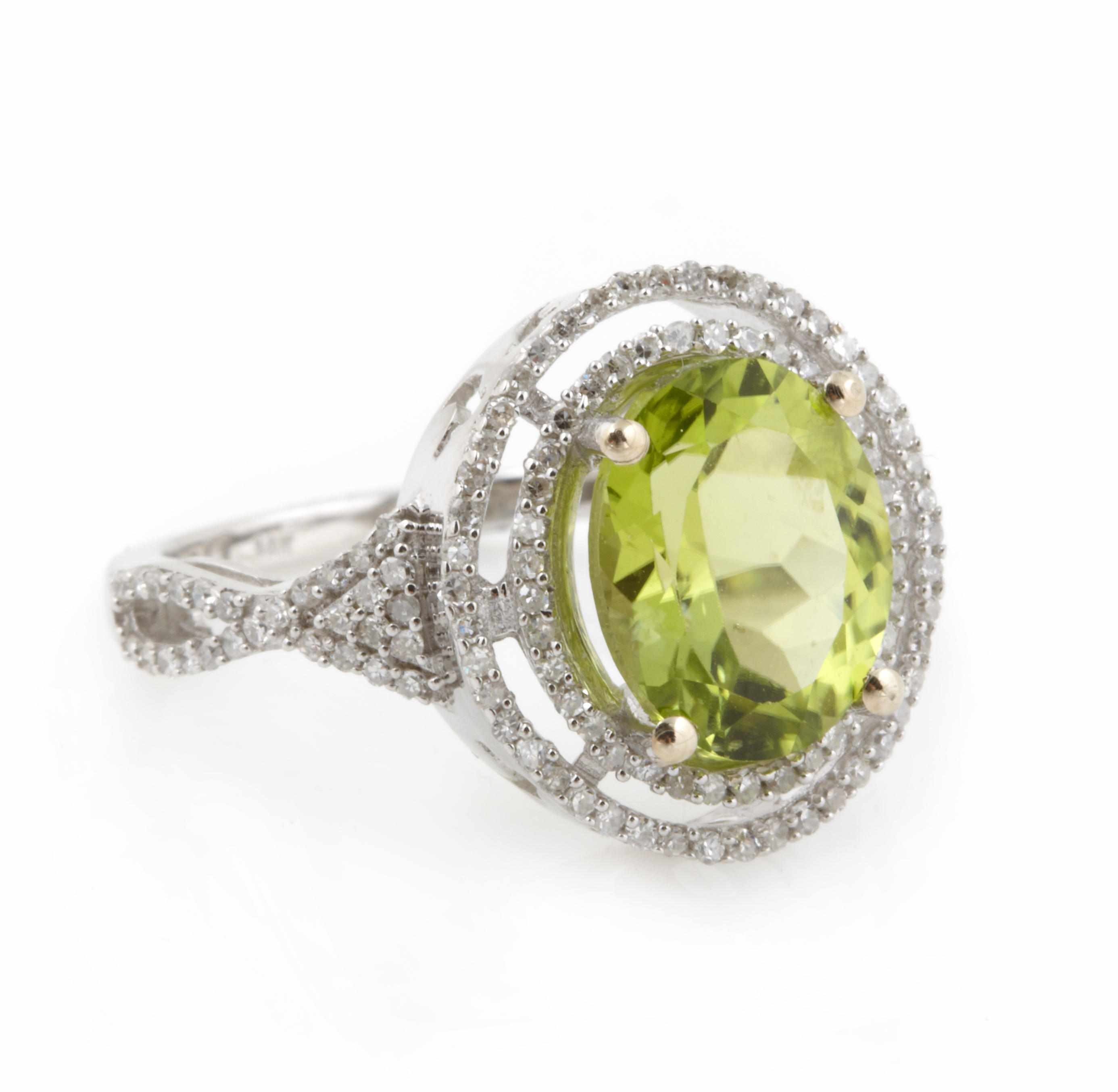 Appraisal: A peridot diamond and k white gold ring size