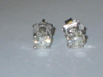 Appraisal: A PAIR OF DIAMOND STUD EARRINGS approximately cts claw set