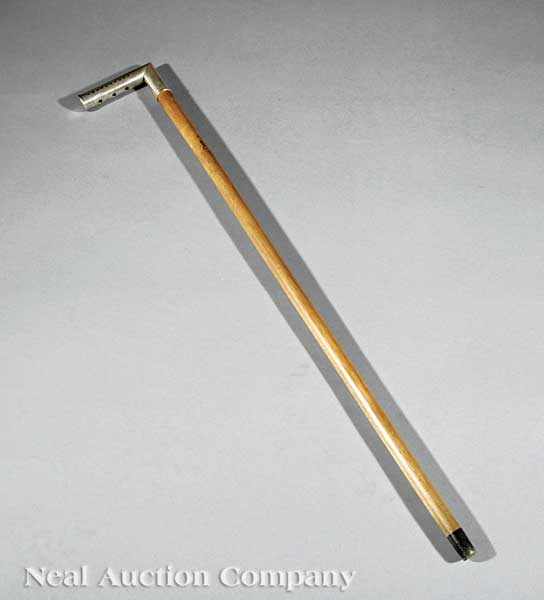 Appraisal: A Harmonica Gadget Cane c the handle with a working