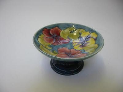 Appraisal: A MOORCROFT POTTERY COMPORT of circular form tube lined in