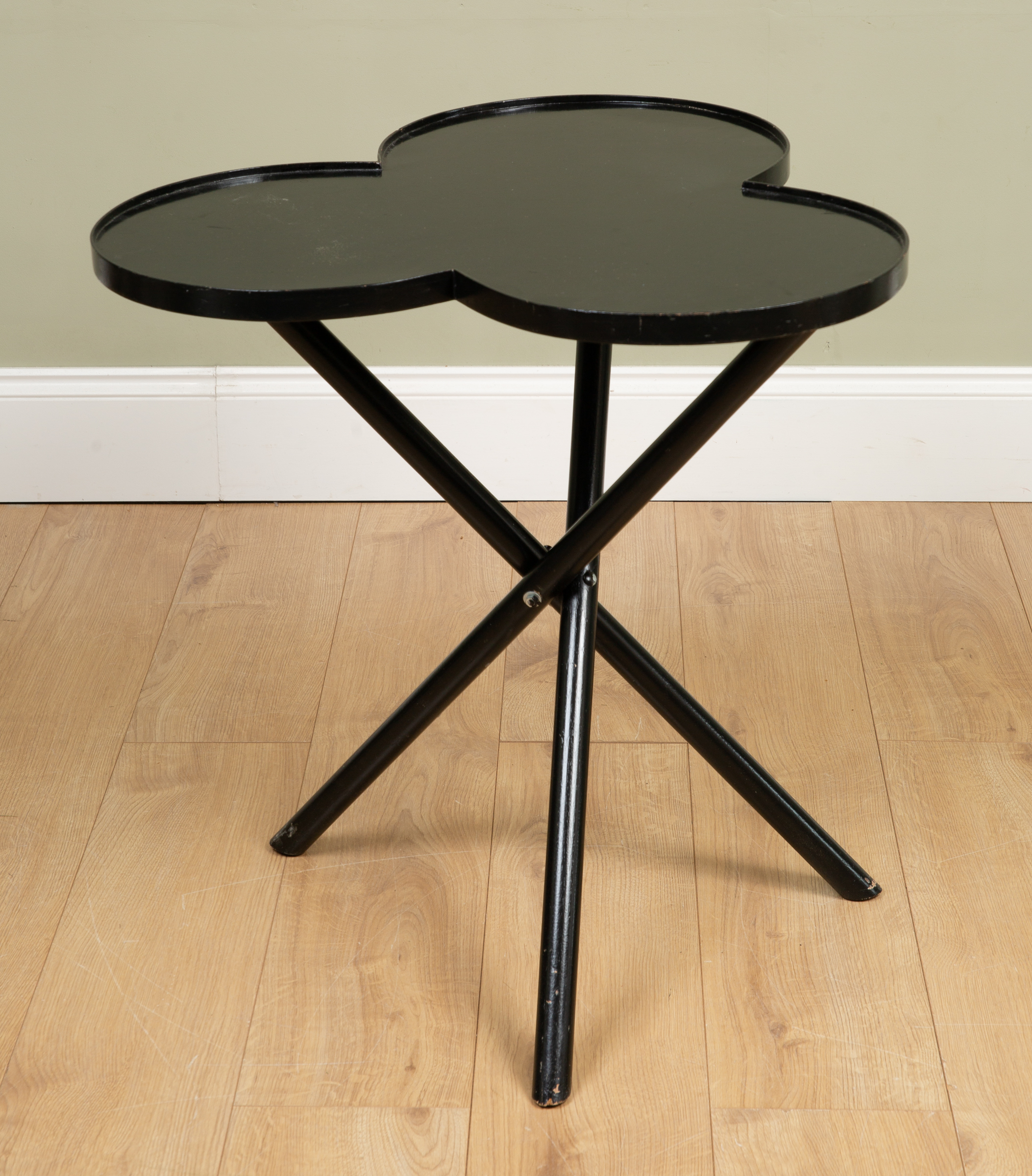 Appraisal: Attributed to Oka a black lacquered trefoil topped occasional table