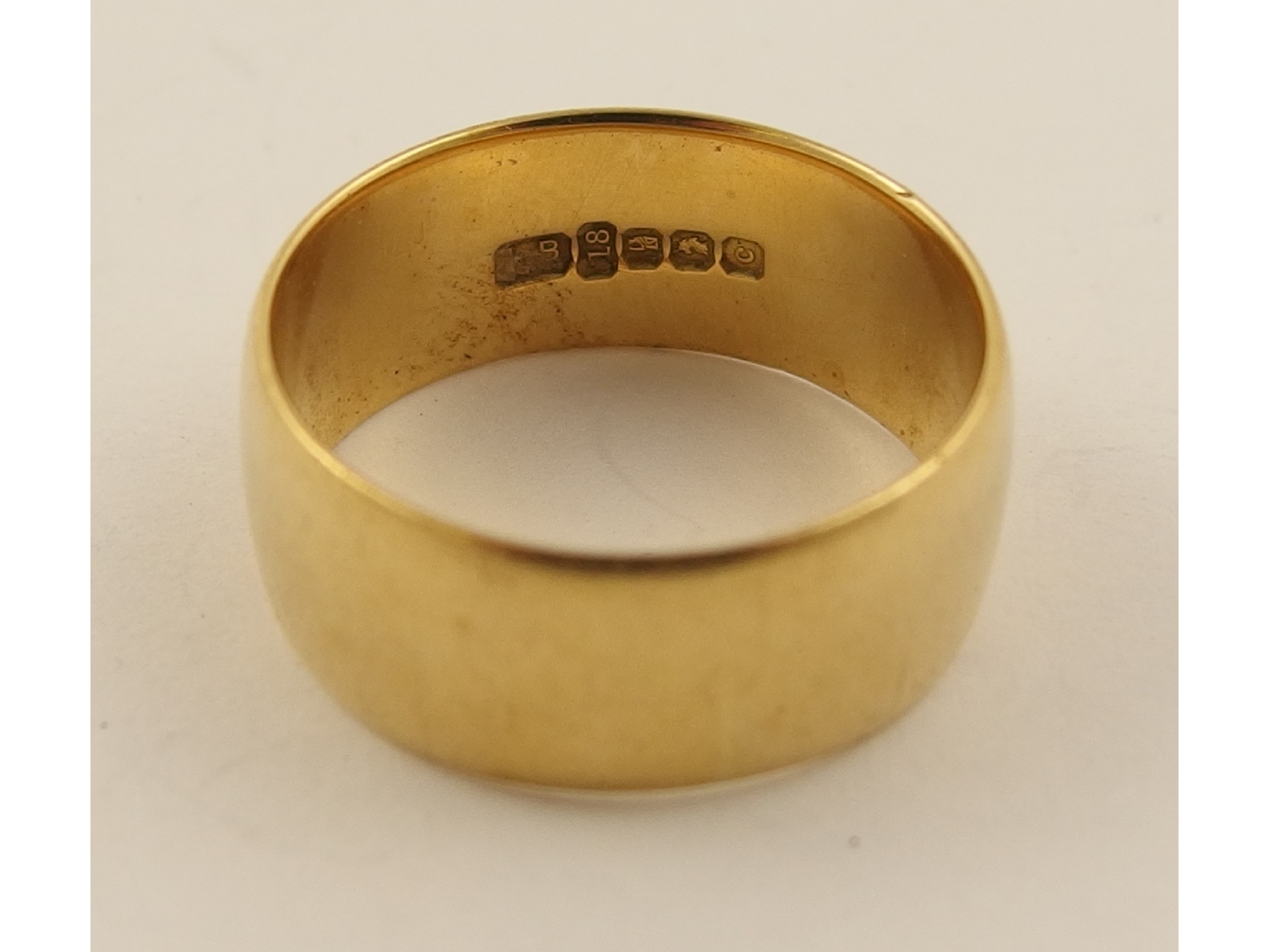 Appraisal: An Irish hallmarked ct wide wedding band weight approx gms