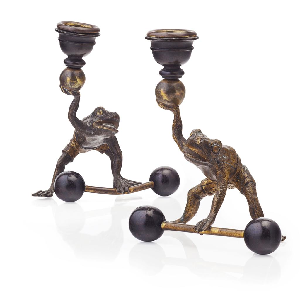 Appraisal: PAIR OF AUSTRIAN NOVELTY PATINATED AND GILT BRONZE CANDLESTICKS TH